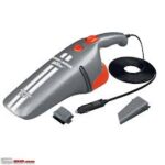 Car vacuum cleaner in use, cleaning the interior of a vehicle at an Indian service center for a fresh and tidy cabin.indian tyre service